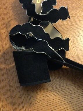 Unisa black suede block heel with gold accent.